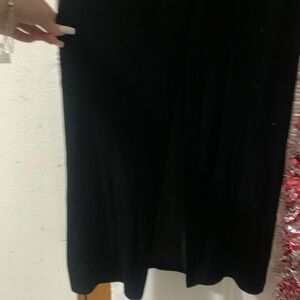 Black, velvet, floor length dress, with a back slit, and a matching handbag